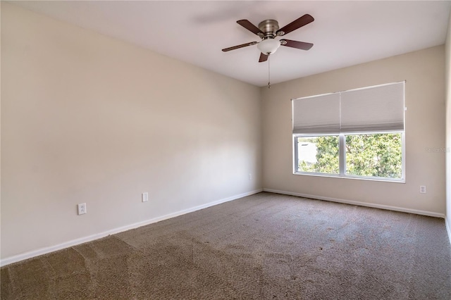 1201 Shelter Rock Rd, Orlando, FL 32835 - spare room with baseboards, carpet flooring, and a ceiling fan
