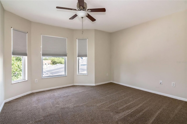 1201 Shelter Rock Rd, Orlando, FL 32835 - unfurnished room with dark carpet, ceiling fan, and baseboards