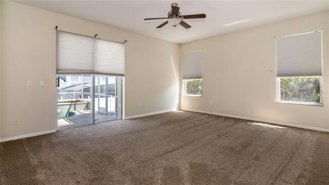 1201 Shelter Rock Rd, Orlando, FL 32835 - empty room with ceiling fan and carpet floors