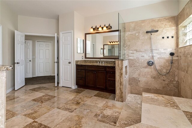 1201 Shelter Rock Rd, Orlando, FL 32835 - bathroom with vanity, a walk in shower, and stone finish floors