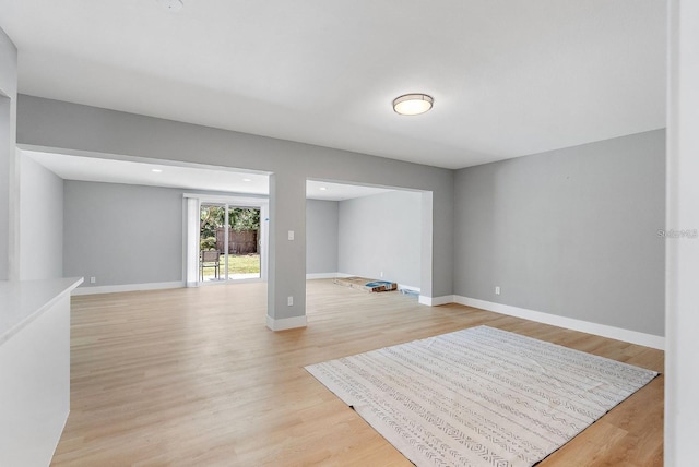 3926 Helena St NE, Saint Petersburg, FL 33703 - empty room featuring light wood-type flooring and baseboards