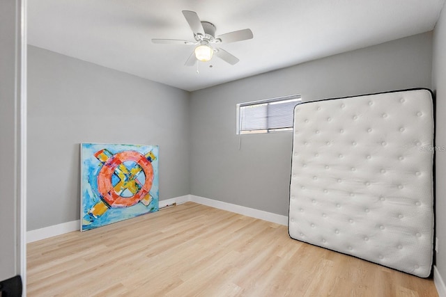 3926 Helena St NE, Saint Petersburg, FL 33703 - empty room featuring wood finished floors, a ceiling fan, and baseboards