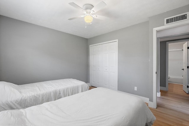 3926 Helena St NE, Saint Petersburg, FL 33703 - bedroom featuring light wood-style flooring, baseboards, a closet, and ceiling fan