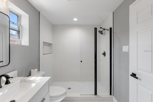 3926 Helena St NE, Saint Petersburg, FL 33703 - full bath with a shower stall, toilet, vanity, and recessed lighting