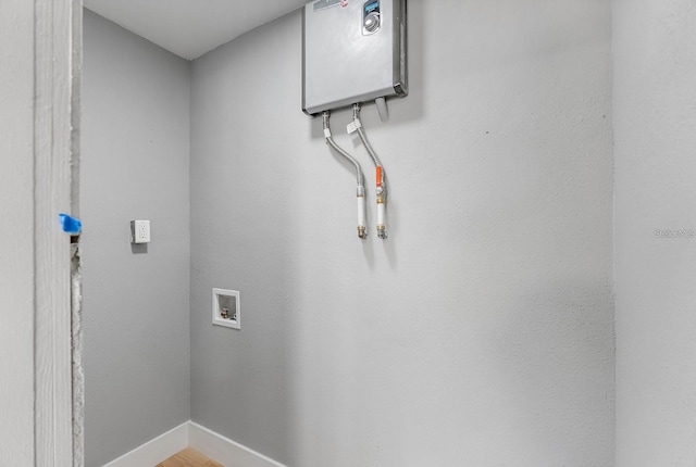 3926 Helena St NE, Saint Petersburg, FL 33703 - washroom featuring hookup for a washing machine and baseboards