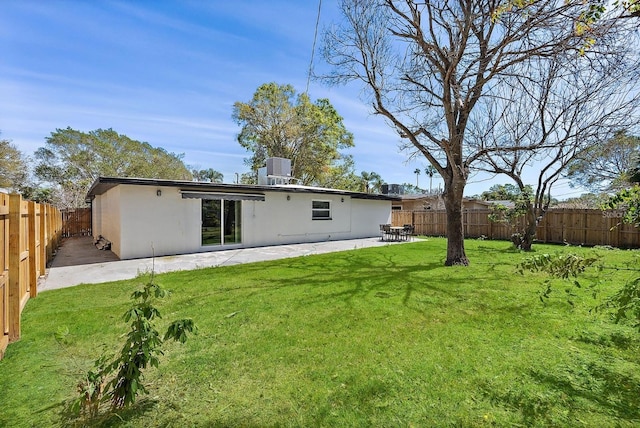 3926 Helena St NE, Saint Petersburg, FL 33703 - back of house featuring stucco siding, a patio area, and central AC unit