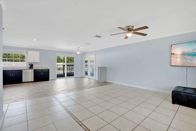 950 Gatewood Ct NE, Palm Bay, FL 32905 - unfurnished living room with healthy amount of natural light, light tile patterned floors, ceiling fan, baseboards, and recessed lighting