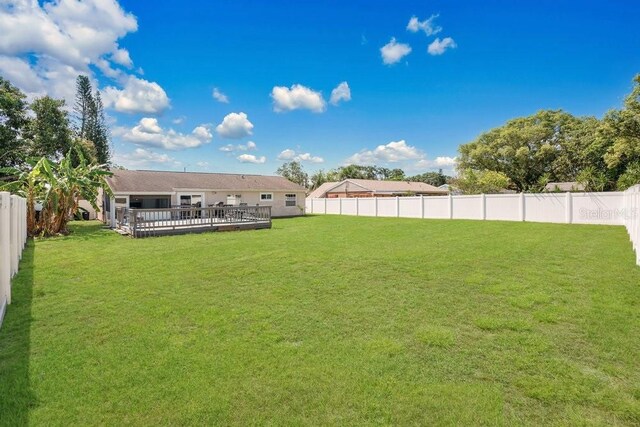 950 Gatewood Ct NE, Palm Bay, FL 32905 - view of yard with a wooden deck