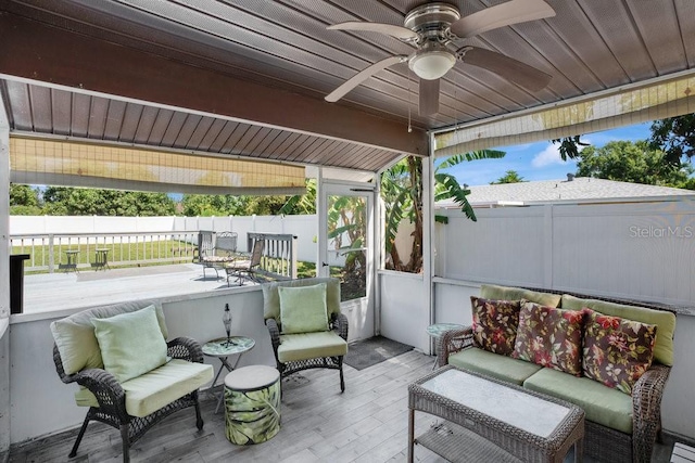 950 Gatewood Ct NE, Palm Bay, FL 32905 - wooden terrace with an outdoor living space, a fenced backyard, and a ceiling fan
