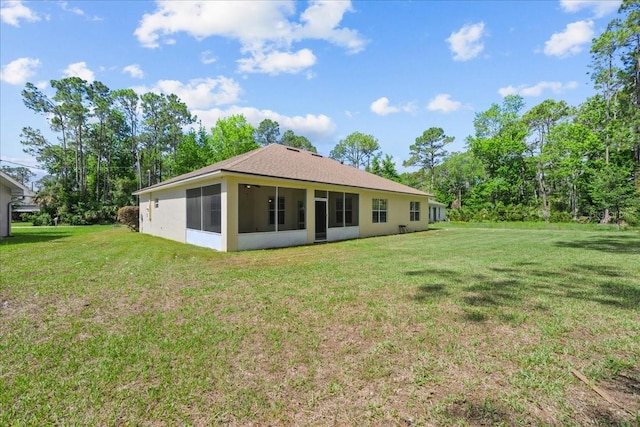 45 Powder Horn Dr, Palm Coast, FL 32164 - rear view of house featuring a sunroom and a lawn