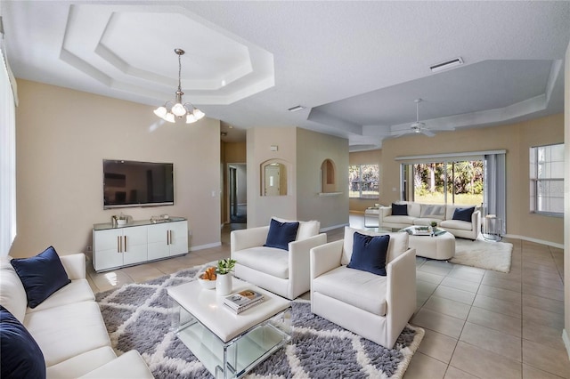 45 Powder Horn Dr, Palm Coast, FL 32164 - living room featuring a tray ceiling, light tile patterned floors, and healthy amount of natural light