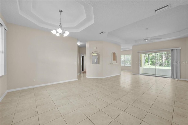 45 Powder Horn Dr, Palm Coast, FL 32164 - unfurnished room with a tray ceiling, a chandelier, and baseboards
