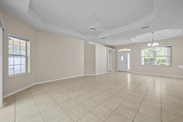 45 Powder Horn Dr, Palm Coast, FL 32164 - unfurnished room featuring a raised ceiling, baseboards, light tile patterned floors, and a ceiling fan