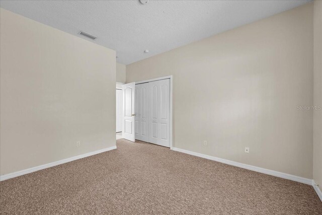45 Powder Horn Dr, Palm Coast, FL 32164 - carpeted spare room featuring baseboards and a textured ceiling