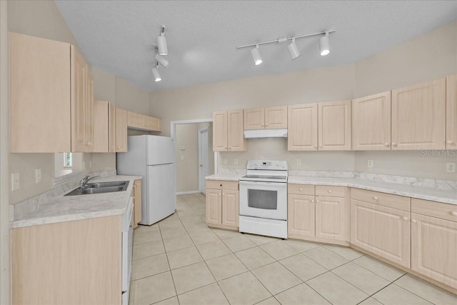 45 Powder Horn Dr, Palm Coast, FL 32164 - kitchen with white appliances, light brown cabinets, under cabinet range hood, and light countertops