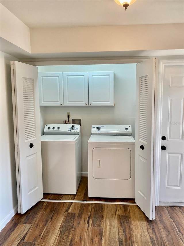 650 Woodridge Dr, Fern Park, FL 32730 - laundry area with washer and dryer, cabinet space, and dark wood-style floors