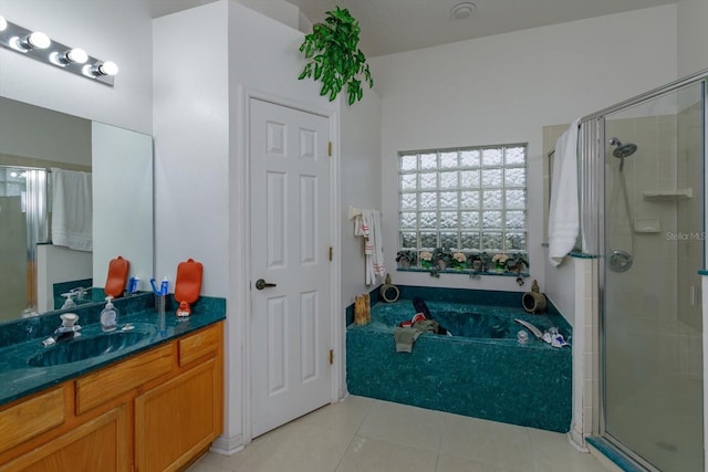 full bathroom with tile patterned flooring, a shower stall, vanity, and a bath