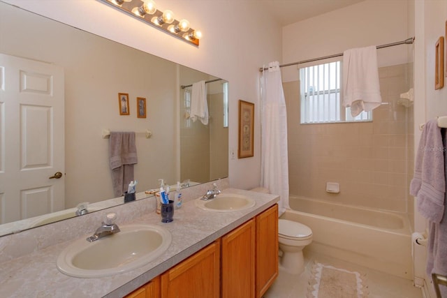 bathroom featuring shower / bath combination with curtain, double vanity, and toilet