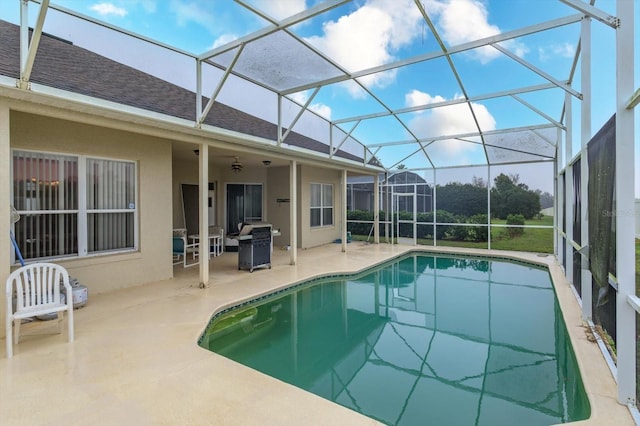 swimming pool with a patio area and a lanai
