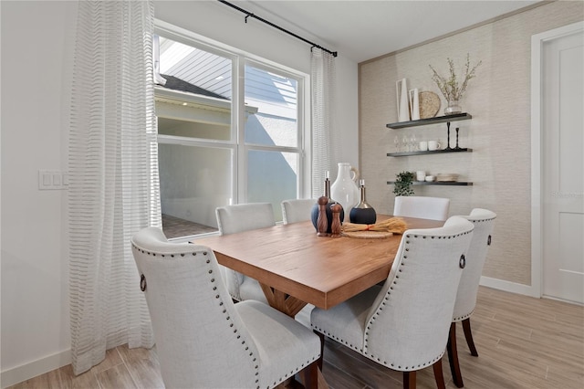2054 Education St, Saint Cloud, FL 34771 - dining area with light wood-style flooring and baseboards