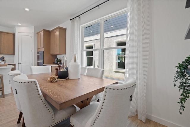 2054 Education St, Saint Cloud, FL 34771 - dining room with light wood-type flooring, recessed lighting, and baseboards