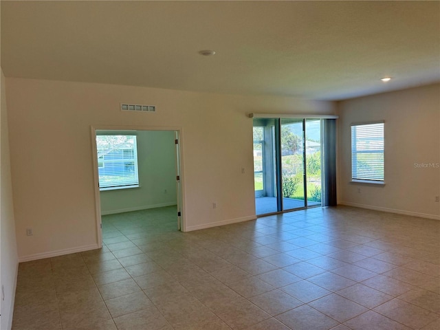 27206 Adams St, Punta Gorda, FL 33983 - spare room featuring light tile patterned flooring, baseboards, and recessed lighting