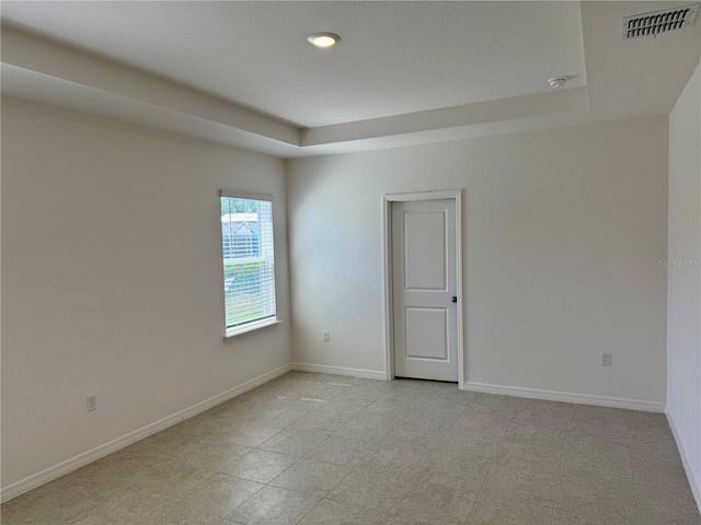 27206 Adams St, Punta Gorda, FL 33983 - spare room with a tray ceiling, baseboards, recessed lighting, and a smoke detector