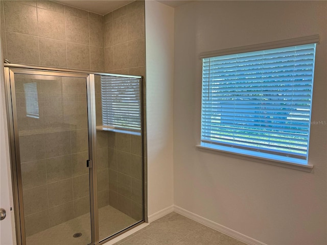 27206 Adams St, Punta Gorda, FL 33983 - bathroom featuring a shower stall, baseboards, and tile patterned flooring