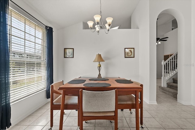 4249 Andover Cay Blvd, Orlando, FL 32825 - dining area featuring vaulted ceiling, plenty of natural light, a chandelier, arched walkways, and stairway