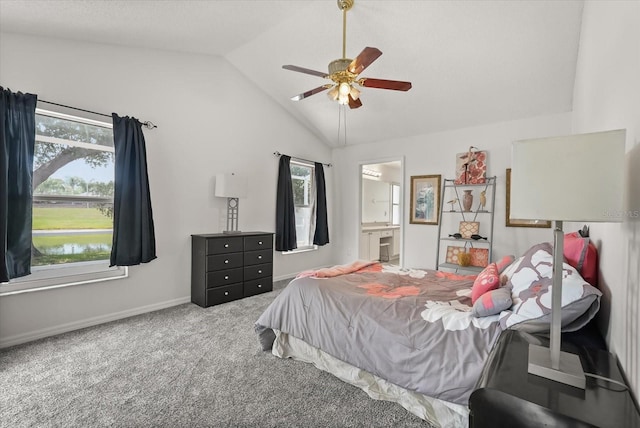 4249 Andover Cay Blvd, Orlando, FL 32825 - carpeted bedroom featuring lofted ceiling, baseboards, connected bathroom, and ceiling fan