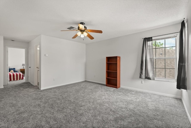 4249 Andover Cay Blvd, Orlando, FL 32825 - carpeted spare room with a ceiling fan, a textured ceiling, and baseboards