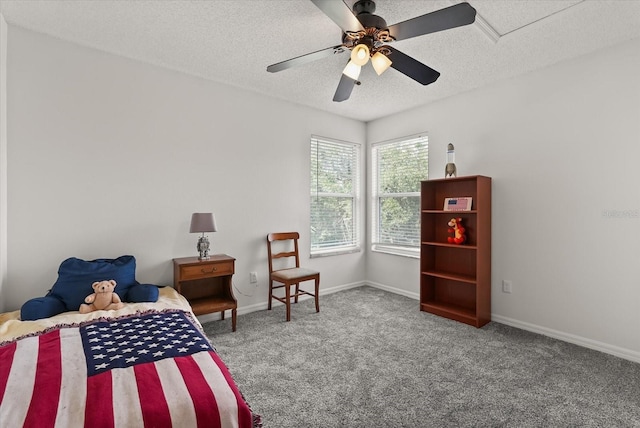 4249 Andover Cay Blvd, Orlando, FL 32825 - bedroom with carpet, a textured ceiling, baseboards, and a ceiling fan
