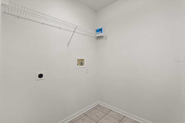 4249 Andover Cay Blvd, Orlando, FL 32825 - laundry room with electric dryer hookup, baseboards, washer hookup, and light tile patterned floors