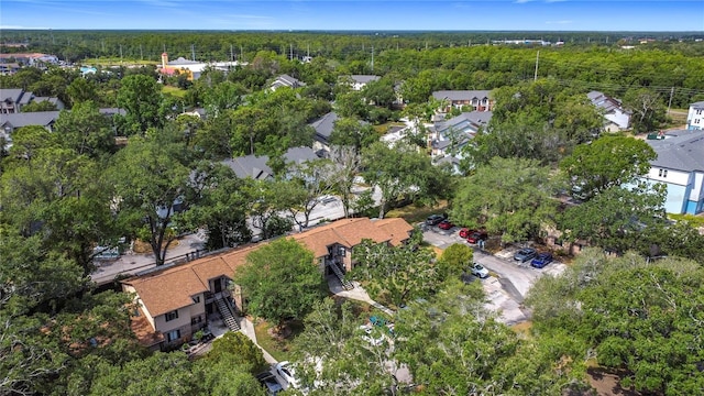 1748 Foxhall Cir Unit 1748, Kissimmee, FL 34741 - aerial overview of property's location with a forest and nearby suburban area