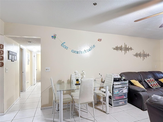 1748 Foxhall Cir Unit 1748, Kissimmee, FL 34741 - dining area featuring a textured ceiling, light tile patterned flooring, and ceiling fan