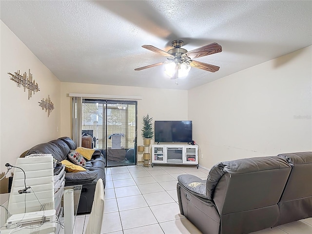 1748 Foxhall Cir Unit 1748, Kissimmee, FL 34741 - living room with a ceiling fan, light tile patterned flooring, and a textured ceiling