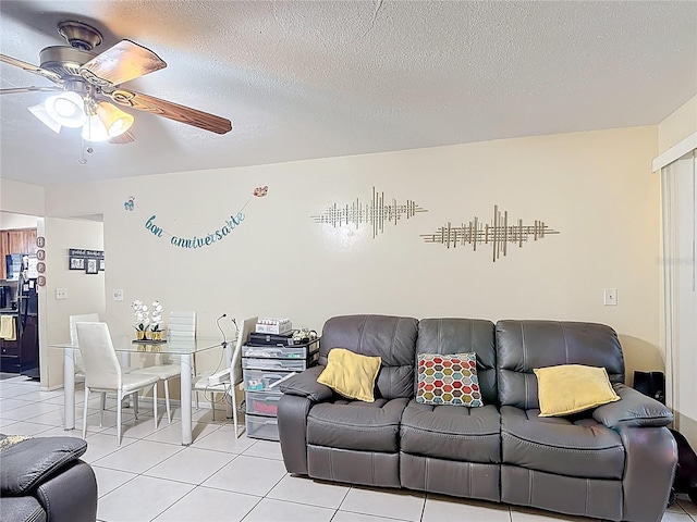 1748 Foxhall Cir Unit 1748, Kissimmee, FL 34741 - living room with a ceiling fan, light tile patterned floors, and a textured ceiling