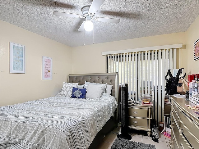 1748 Foxhall Cir Unit 1748, Kissimmee, FL 34741 - bedroom with light tile patterned floors, a textured ceiling, and ceiling fan