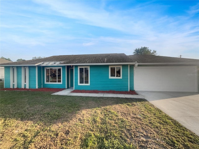 3321 Crimson Ln, Deltona, FL 32738 - ranch-style home with concrete driveway, a garage, and a front lawn