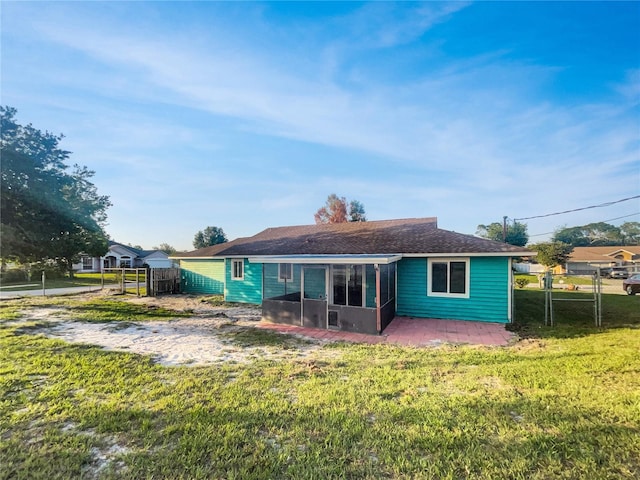 3321 Crimson Ln, Deltona, FL 32738 - rear view of house with a gate and a sunroom
