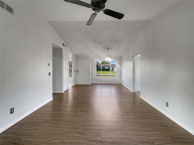 3321 Crimson Ln, Deltona, FL 32738 - unfurnished living room featuring dark wood-style flooring, a ceiling fan, vaulted ceiling, and baseboards