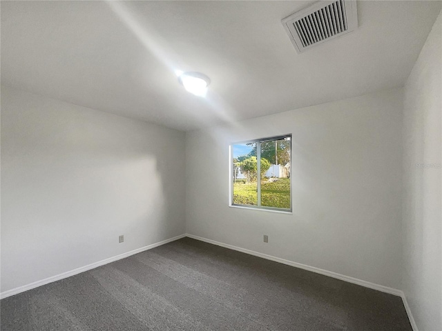 3321 Crimson Ln, Deltona, FL 32738 - unfurnished room featuring baseboards and dark colored carpet