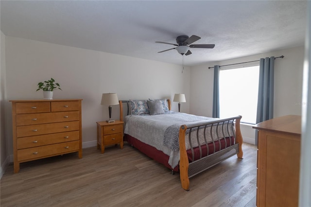 5547 Garden Grove Cir, Winter Park, FL 32792 - bedroom featuring light wood finished floors, baseboards, and ceiling fan