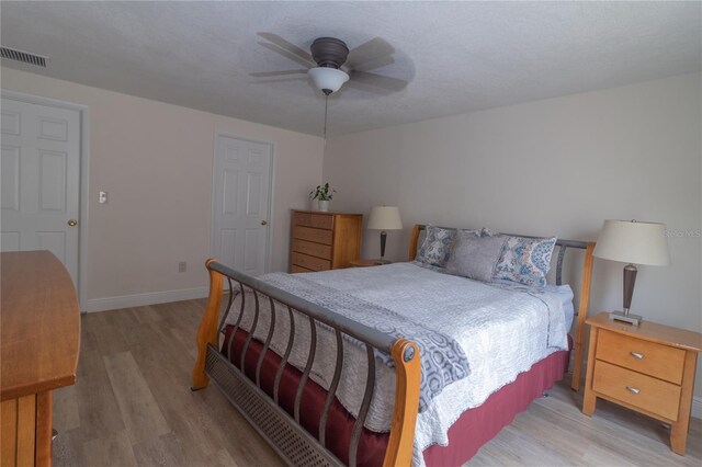 5547 Garden Grove Cir, Winter Park, FL 32792 - bedroom featuring light wood finished floors, baseboards, and a ceiling fan
