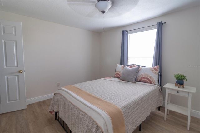 5547 Garden Grove Cir, Winter Park, FL 32792 - bedroom featuring light wood-style flooring, baseboards, and a ceiling fan