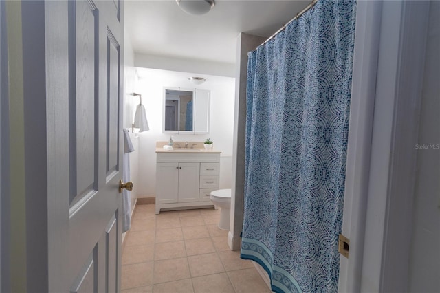 5547 Garden Grove Cir, Winter Park, FL 32792 - full bath featuring vanity, tile patterned flooring, toilet, and a shower with shower curtain