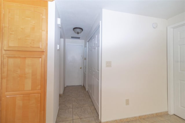 5547 Garden Grove Cir, Winter Park, FL 32792 - hall with light tile patterned floors and baseboards