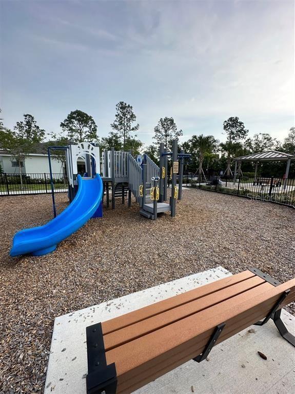 17148 Cagan Crossings Blvd, Clermont, FL 34714 - community playground with fence