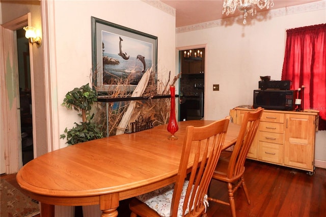 330 Phoenix Ave, Daytona Beach, FL 32118 - dining room with dark wood-style flooring and a chandelier
