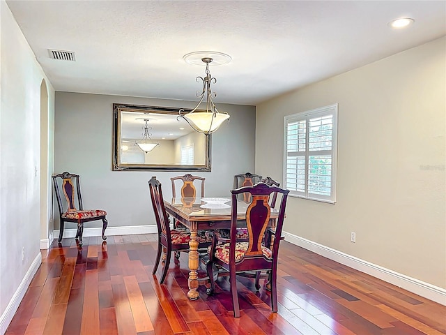 5127 Leeward Way, Orlando, FL 32809 - dining room with dark wood finished floors, baseboards, and recessed lighting